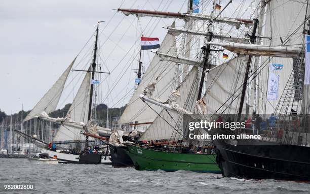 June 2018, Germany, Kiel: Traditional sailing ships during the windjammer parade at the Kieler Woche . There are considerably less tall ships who...