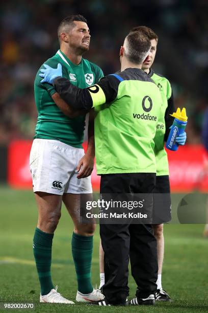 Rob Kearney of Ireland receives attention from the trainer during the Third International Test match between the Australian Wallabies and Ireland at...