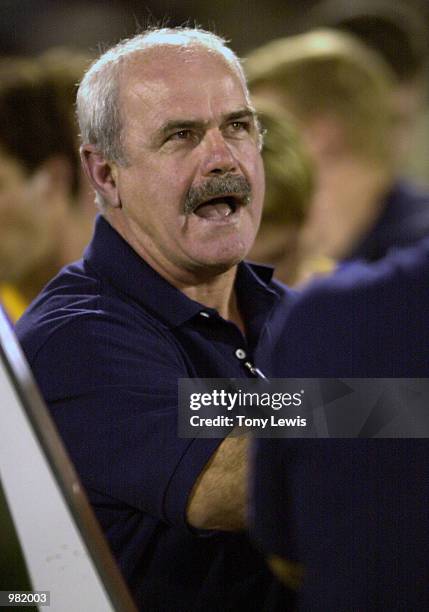 Brisbane coach Leigh Matthews addresses palyers at quarter time in the Ansett Cup Grand Final between the Brisbane Lions and Port Power played at...