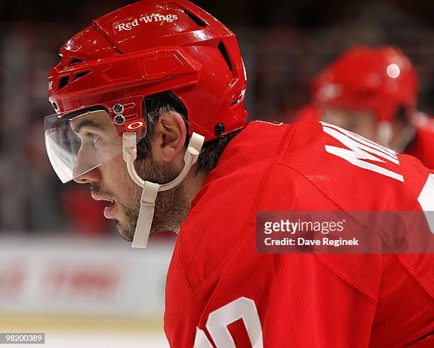 Drew Miller of the Detroit Red Wings gets set for the face-off during an NHL game against the Edmonton Oilers at Joe Louis Arena on March 30, 2010 in...