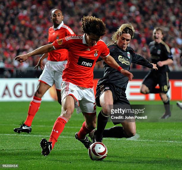 Fernando Torres of Liverpool competes with David Luiz of Benfica during the UEFA Europa League quarter final first leg match between Benfica and...