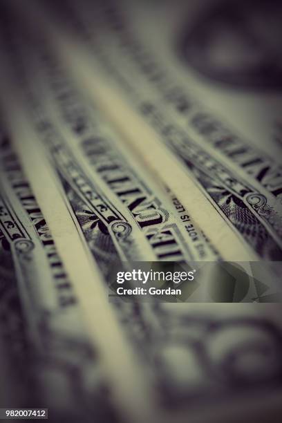 us dollars background , artistic processed and toned photo - bringing home the bacon stock pictures, royalty-free photos & images