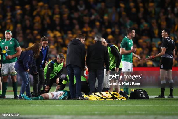 Peter O'Mahony of Ireland lies down injured after a challenge by Israel Folau of the Wallabies during the Third International Test match between the...