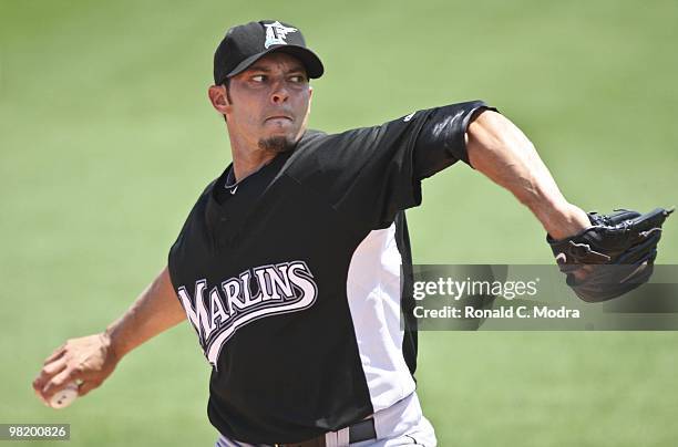 Pitcher Clay Hensley of the Florida Marlins pitches during a game against the St. Louis Cardinals at Roger Dean Stadium on March 27, 2010 in Jupiter,...