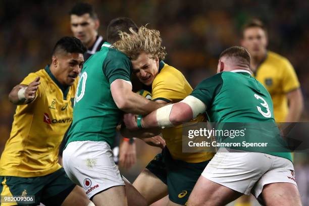 Ned Hanigan of the Wallabies is tackled during the Third International Test match between the Australian Wallabies and Ireland at Allianz Stadium on...