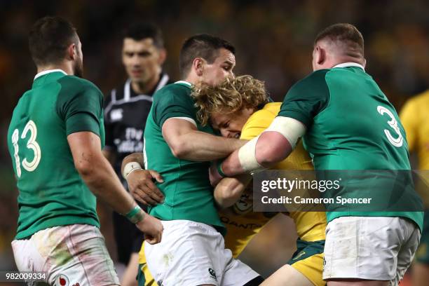 Ned Hanigan of the Wallabies is tackled during the Third International Test match between the Australian Wallabies and Ireland at Allianz Stadium on...