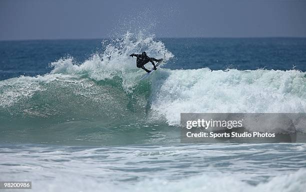 Surfer rides a wave at the Hurley U.S. Open of Surfing on July 25, 2009 in Huntington Beach, California.