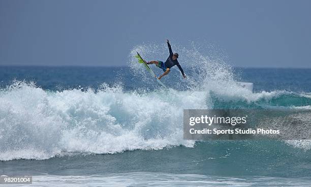 Surfer rides a wave at the Hurley U.S. Open of Surfing on July 25, 2009 in Huntington Beach, California.