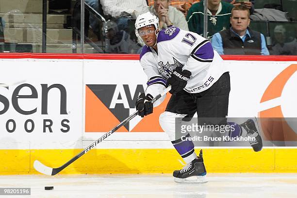 Wayne Simmonds of the Los Angeles Kings skates with the puck along the boards against the Minnesota Wild during the game at the Xcel Energy Center on...