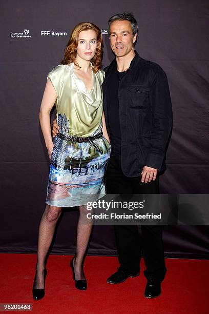 Actress Thekla Reuten and actor Hannes Jaenicke attend the premiere of 'Waffenstillstand' at cinema Kulturbrauerei on April 1, 2010 in Berlin,...