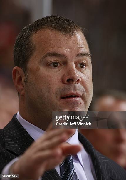 Head coach Alain Vigneault of the Vancouver Canucks looks on from the bench during the game against the Ottawa Senators at General Motors Place on...