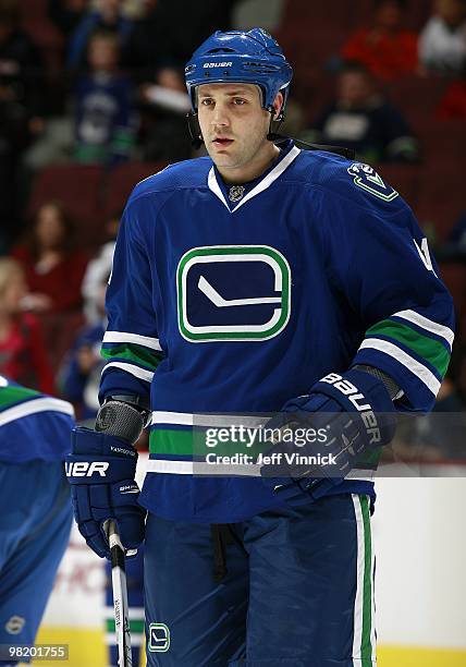 Andrew Alberts of the Vancouver Canucks looks on from the bench during the game against the Ottawa Senators at General Motors Place on March 13, 2010...