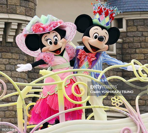 Mickey and Minnie Mouse perform on a float during the press preview for the new parade "Disney Easter Wonderland" at the Tokyo Disneyland at Urayasu...