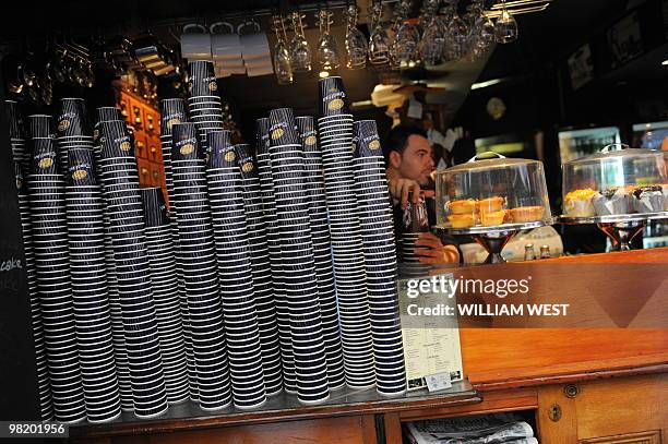 Barista makes coffee in one of Melbourne's inner-city laneways which is home to many vibrant bars, cafes, restaurants, boutiques, sushi bars and...