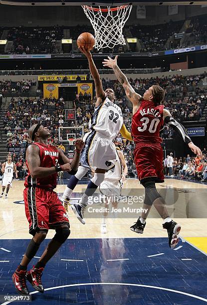 Mayo of the Memphis Grizzlies goes to the basket against Michael Beasley of the Miami Heat during the game on February 19, 2010 at FedExForum in...