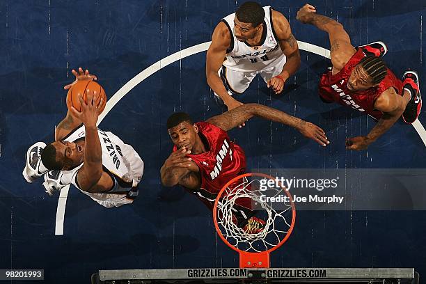 Darrell Arthur of the Memphis Grizzlies grabs the rebound against Dorell Wright of the Miami Heat during the game on February 19, 2010 at FedExForum...