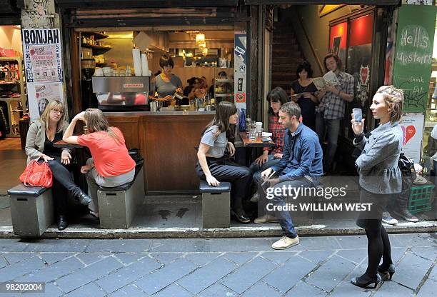 People enjoy their lunch in one of Melbourne's inner-city laneways which is home to many vibrant bars, cafes, restaurants, boutiques, sushi bars and...