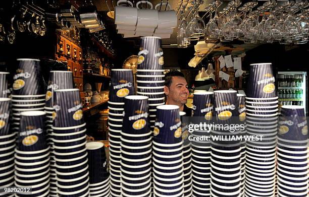 Barista makes coffee in one of Melbourne's inner-city laneways which is home to many vibrant bars, cafes, restaurants, boutiques, sushi bars and...