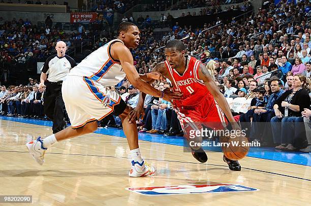 Aaron Brooks of the Houston Rockets drives against Russell Westbrook of the Oklahoma City Thunder during the game on March 24, 2010 at the Ford...
