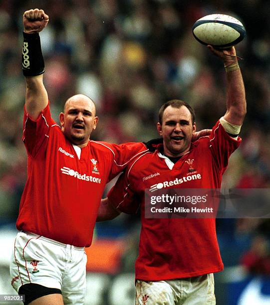 Scott Quinnell and brother Craig of Wales celebrate victory after the match between France v Wales in the Six Nations Championship at the Stade de...