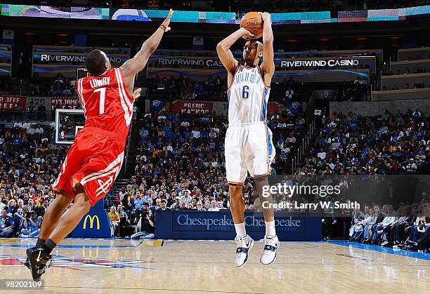 Eric Maynor of the Oklahoma City Thunder shoots against Kyle Lowry of the Houston Rockets during the game on March 24, 2010 at the Ford Center in...