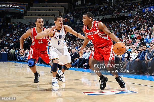 Kyle Lowry of the Houston Rockets drives against Thabo Sefolosha of the Oklahoma City Thunder during the game on March 24, 2010 at the Ford Center in...