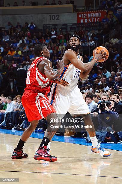 James Harden of the Oklahoma City Thunder handles the ball against Jermaine Taylor of the Houston Rockets during the game on March 24, 2010 at the...