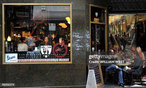 People enjoy their lunch in one of Melbourne's inner-city laneways which is home to many vibrant bars, cafes, restaurants, boutiques, sushi bars and...