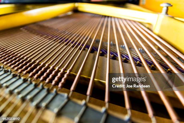 piano - musical instrument string stock pictures, royalty-free photos & images