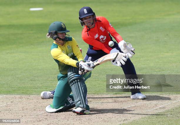 Sarah Taylor of England looks on as Dane Van Niekerk of South Africa scores runs during the International T23 Tri-Series match between England Women...