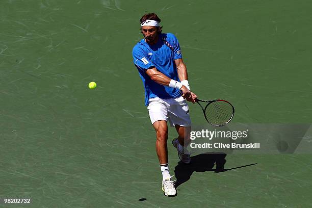 Juan Carlos Ferrero of Spain plays against Jo-Wilfried Tsonga of France during day eight of the 2010 Sony Ericsson Open at Crandon Park Tennis Center...