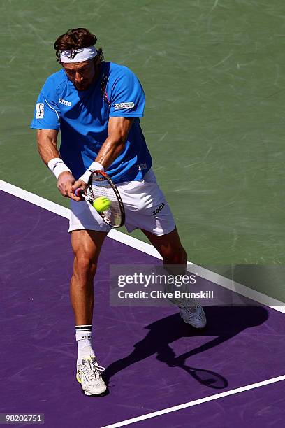 Juan Carlos Ferrero of Spain plays against Jo-Wilfried Tsonga of France during day eight of the 2010 Sony Ericsson Open at Crandon Park Tennis Center...