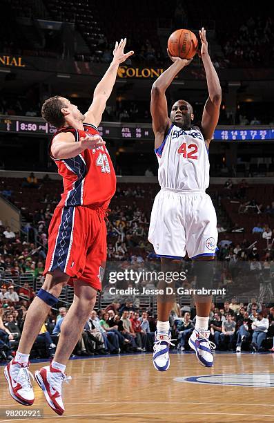 Elton Brand of the Philadelphia 76ers shoots against Kris Humphries of the New Jersey Nets during the game on March 17, 2010 at Wachovia Center in...