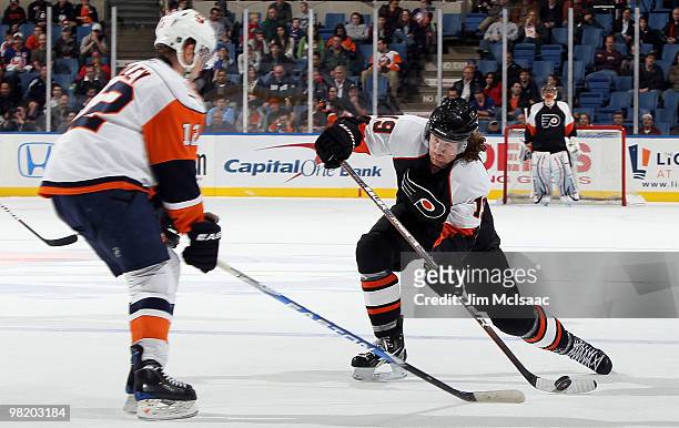 Scott Hartnell of the Philadelphia Flyers attempts a shot against Josh Bailey of the New York Islanders on April 1, 2010 at Nassau Coliseum in...
