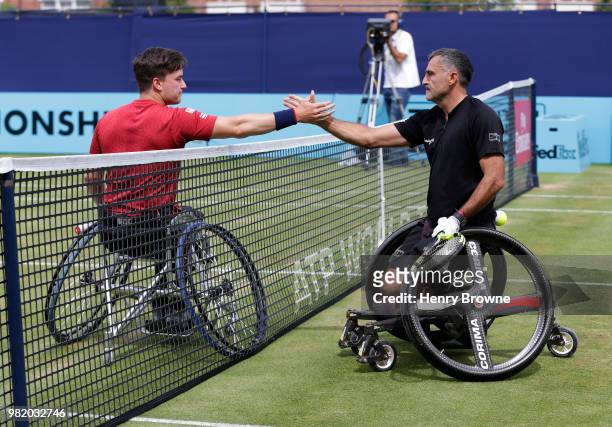 Stephane Houdet of France shakes hands with Gordon Reid of Great Britain after winning the men's wheelchair match during Day 6 of the Fever-Tree...