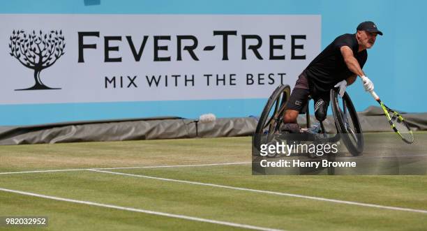 Stephane Houdet of France serves during the men's wheelchair match against Gordon Reid of Great Britain during Day 6 of the Fever-Tree Championships...