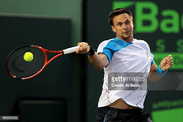 Robin Soderling of Switzerland returns a shot against Mikhail Youzhny of Russia during day ten of the 2010 Sony Ericsson Open at Crandon Park Tennis...