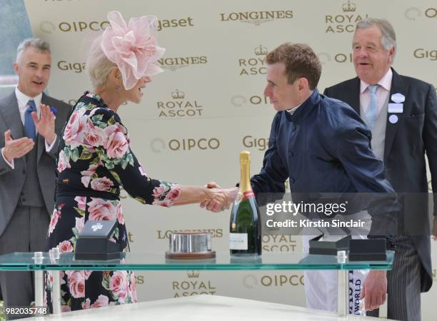 Dame Helen Mirren DBE congratulates Jockey Ryan Moore on winning the Hardwicke Stakes Cup on day 5 of Royal Ascot at Ascot Racecourse on June 23,...