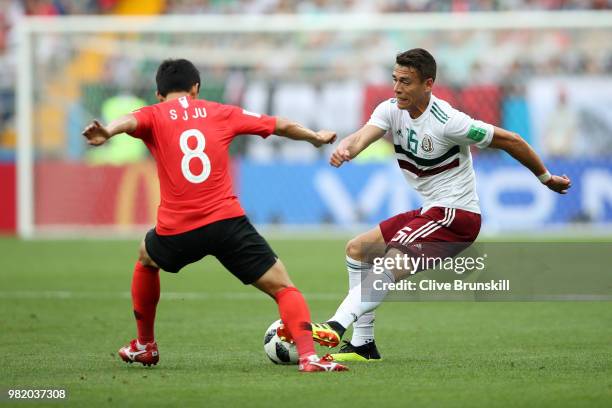 Ju Se-Jong of Korea Republic tackles Hector Moreno of Mexico during the 2018 FIFA World Cup Russia group F match between Korea Republic and Mexico at...