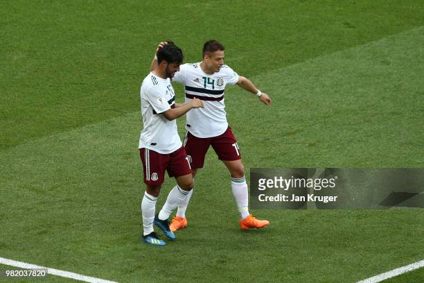 Carlos Vela of Mexico celebrates with teammate Javier Hernandez after scoring a penalty for his team's first goal during the 2018 FIFA World Cup...