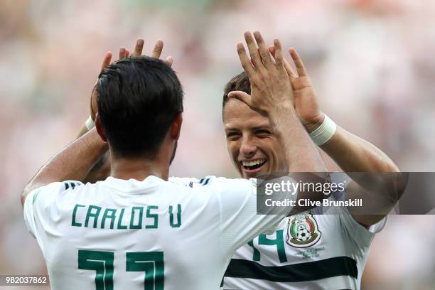 Carlos Vela of Mexico celebrates with teammate Javier Hernandez after scoring a penalty for his team's first goal during the 2018 FIFA World Cup...