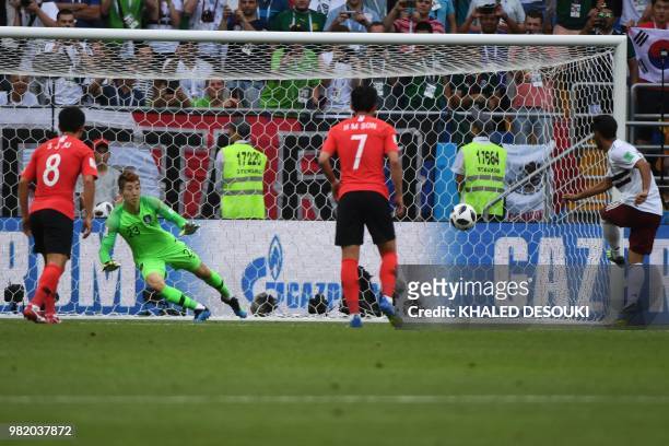 Mexico's forward Carlos Vela scores a penalty for the opening goal during the Russia 2018 World Cup Group F football match between South Korea and...