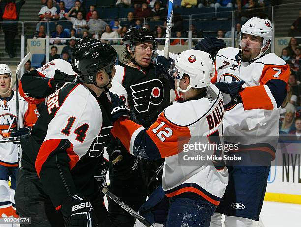 Ian Laperriere and Braydon Coburn of the Philadelphia Flyers get into a scrap with Josh Bailey and Trent Hunter of the New York Islanders on April 1,...