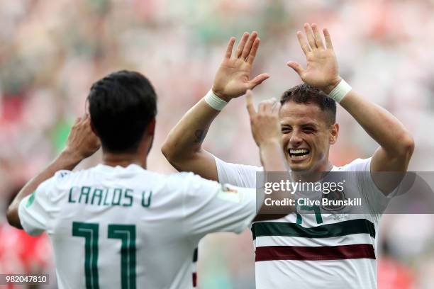Carlos Vela of Mexico celebrates with teammate Javier Hernandez after scoring a penalty for his team's first goal during the 2018 FIFA World Cup...