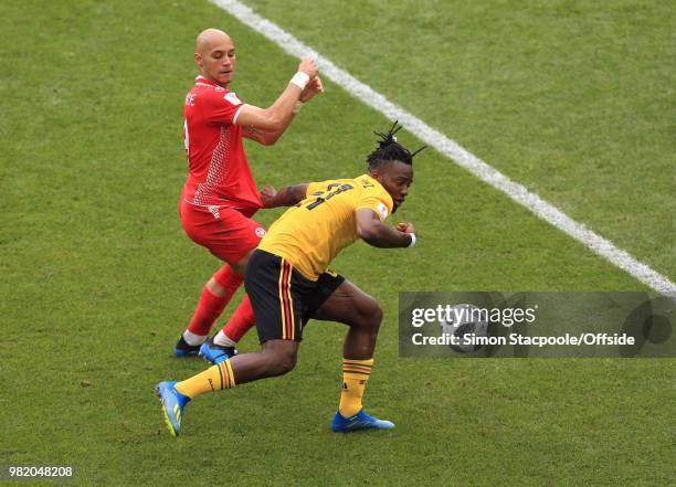 Michy Batshuayi of Belgium shields the ball from Yohan Benalouane of Tunisia during the 2018 FIFA World Cup Russia Group G match between Belgium and...