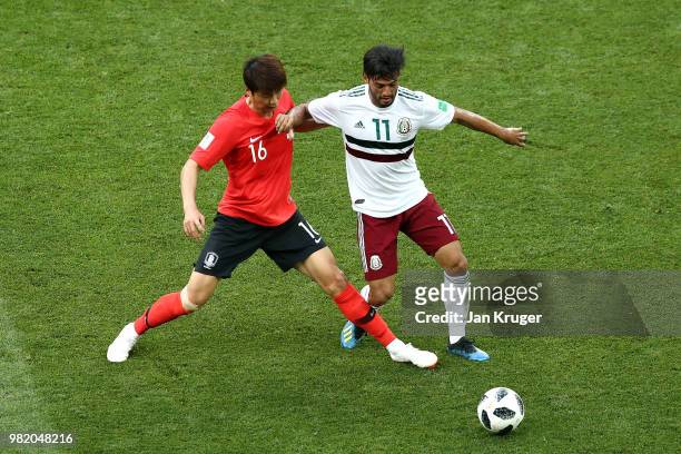 Carlos Vela of Mexico battles for possession with Ki Sung-Yueng of Korea Republic during the 2018 FIFA World Cup Russia group F match between Korea...