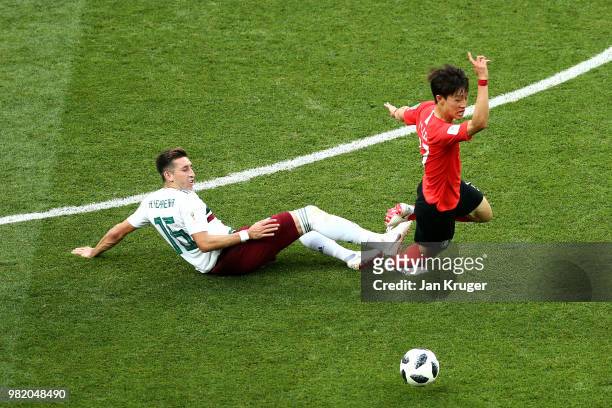 Hector Moreno of Mexico tackles Lee Jae-Sung of Korea Republic during the 2018 FIFA World Cup Russia group F match between Korea Republic and Mexico...