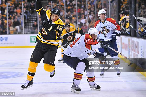 Marco Sturm of the Boston Bruins checks Bryan McCabe of the Florida Panthers at the TD Garden on April 1, 2010 in Boston, Massachusetts.