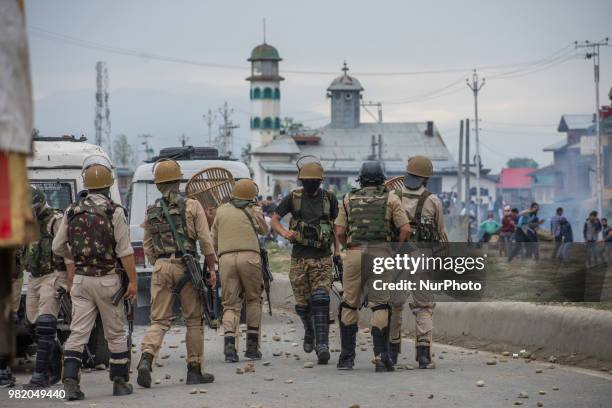 Kashmir Muslim protesters throw stones at Indian government forces during a protest on June 22, 2018 in Srinagar, the summer capital of Indian...