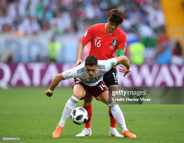 Javier Hernandez of Mexico is challenged by Ki Sung-Yueng of Korea Republic during the 2018 FIFA World Cup Russia group F match between Korea...